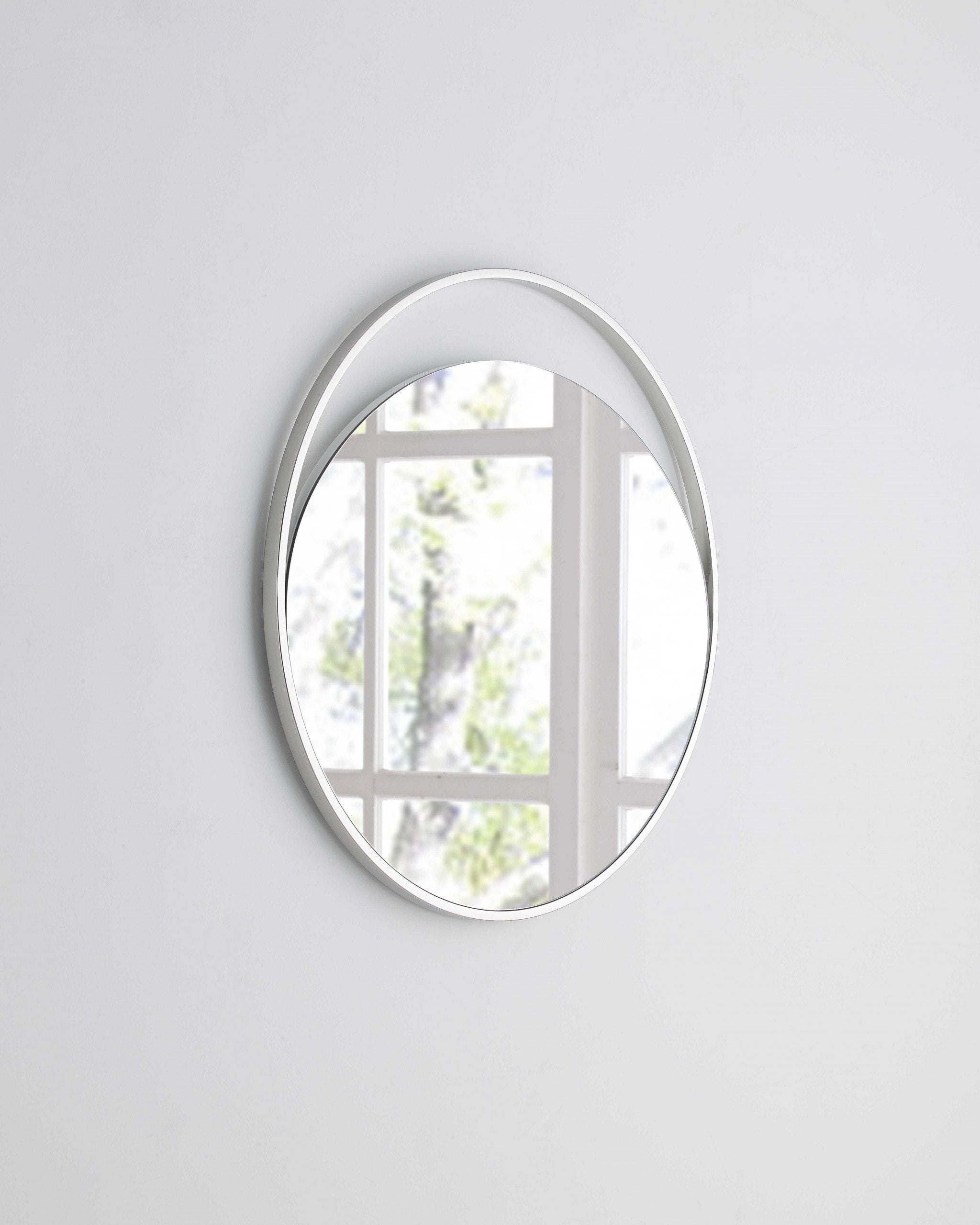 Medium Round Mirror In Matte White. Polished Stainless Steel Frame.